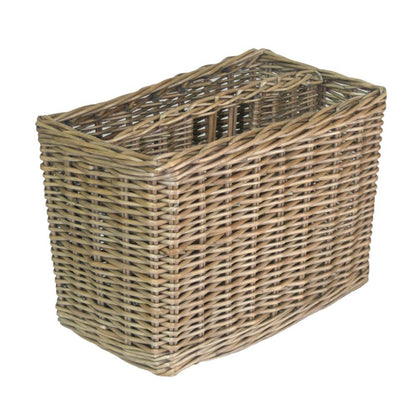 Empty antique wicker magazine rack with curved handles, shown on plain white background in rustic countryside style.