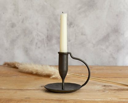Ashford iron candle holder hand forged taper holder styled on wooden table top
