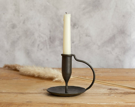 Ashford iron candle holder hand forged taper holder styled on wooden table top
