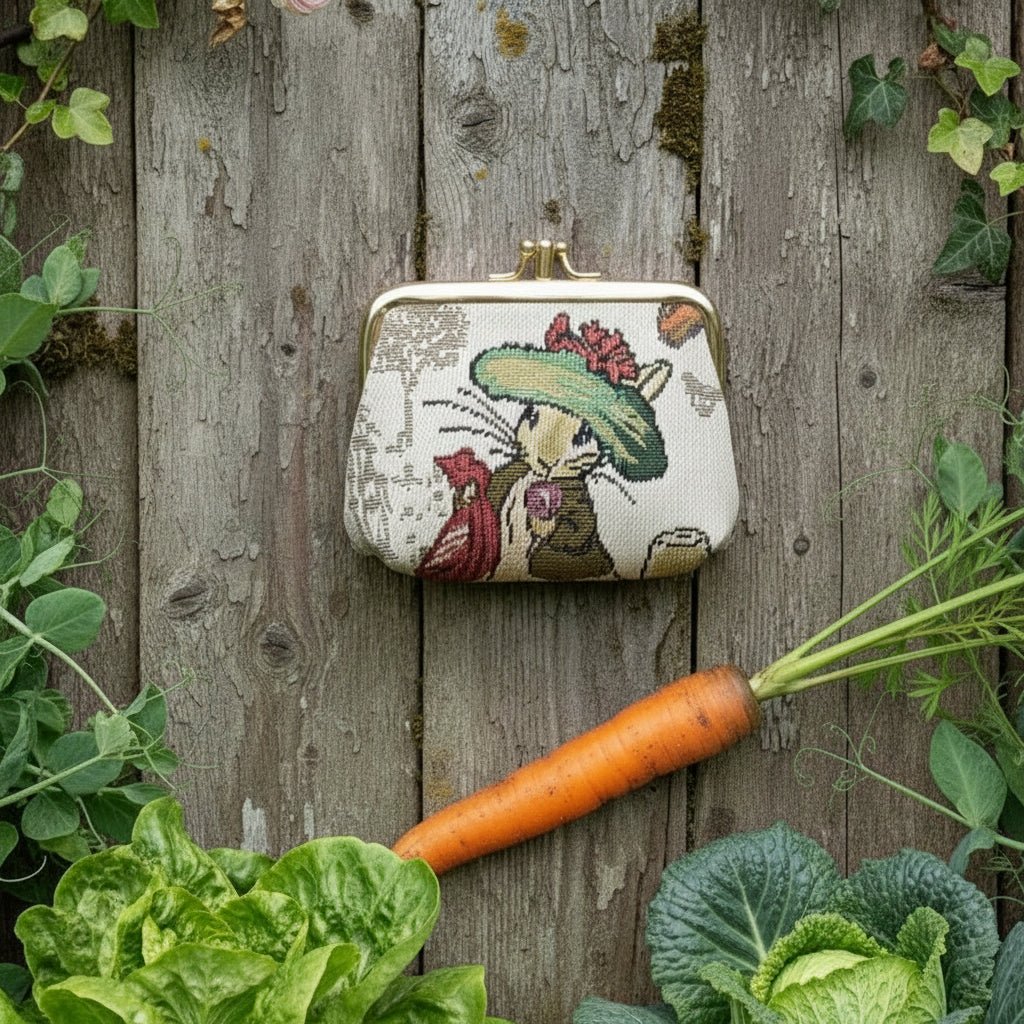Beatrix Potter Benjamin Bunny countryside frame purse front view on wooden table with vegetables around it