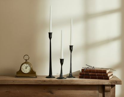 Bloomsbury Iron Black Candle Holder Set of 3 styled on mantle with books, lavender and clock