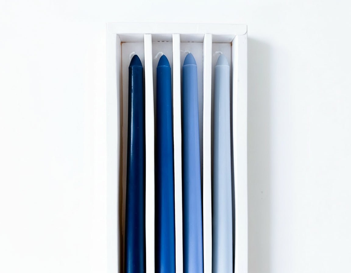 Blue taper candles floral scented box of four displayed in box
