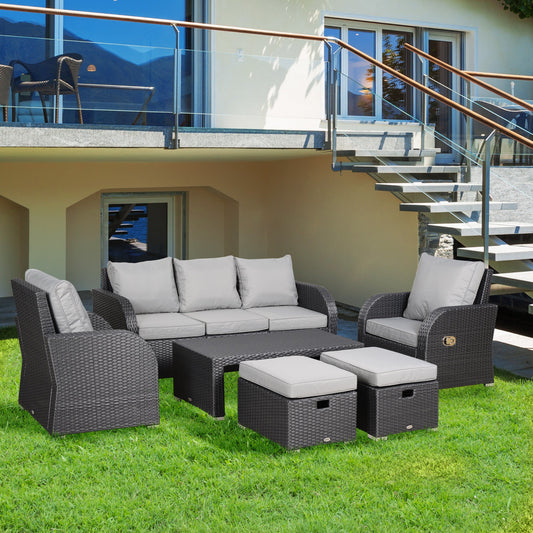 The Bramblefold Gathering – 7-seater outdoor rattan furniture set in weathered grey, styled on grass with reclining chairs, sofa, footstools, and table