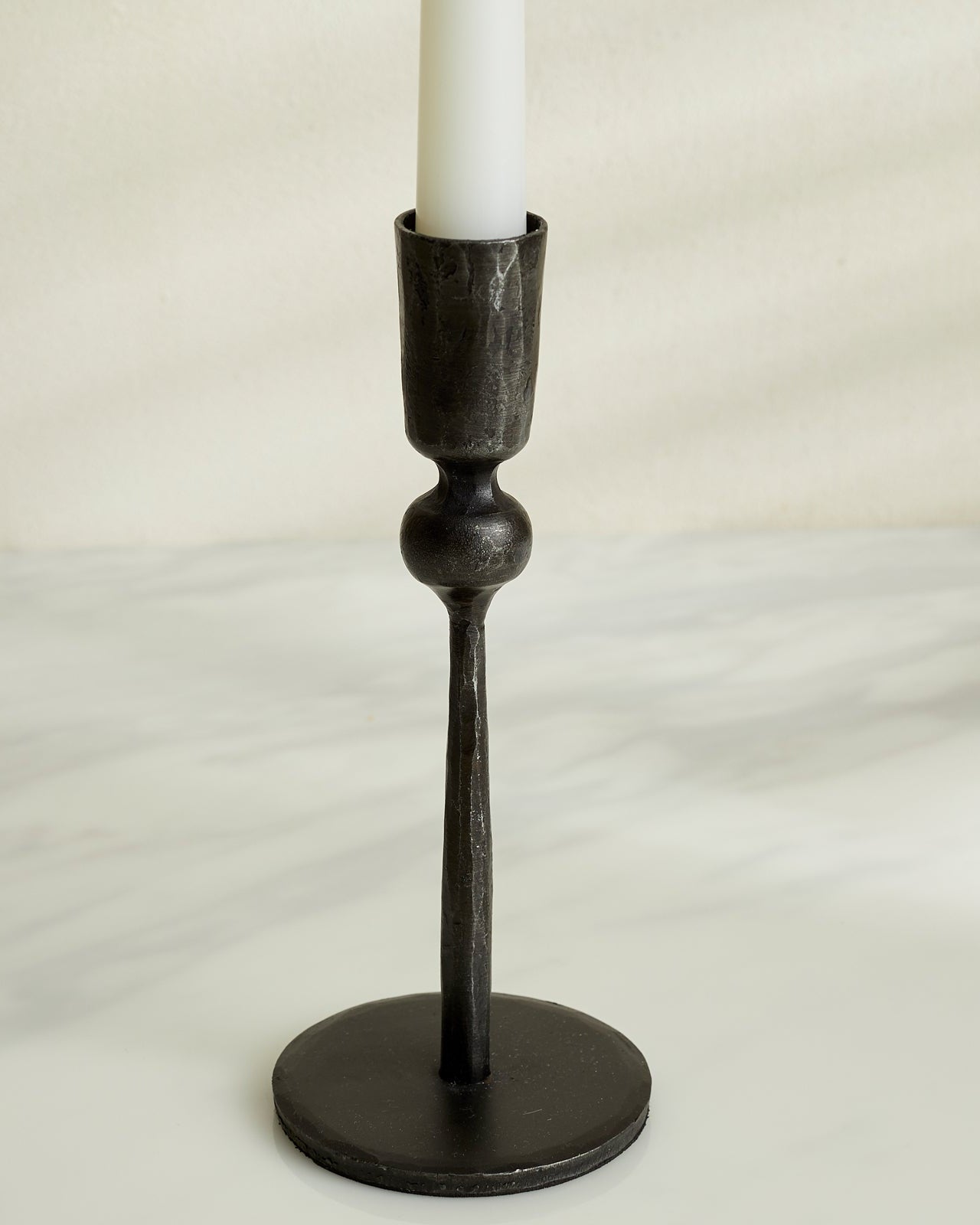 Close view of Coalbrook iron black candle holder showing matte black finish and solid iron form