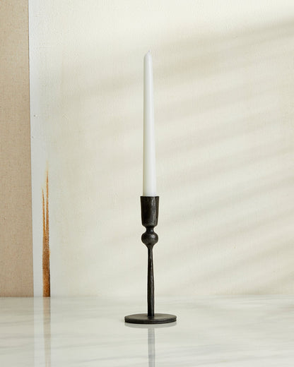 Coalbrook iron black candle holder on marble table with natural wall, minimalist heritage style