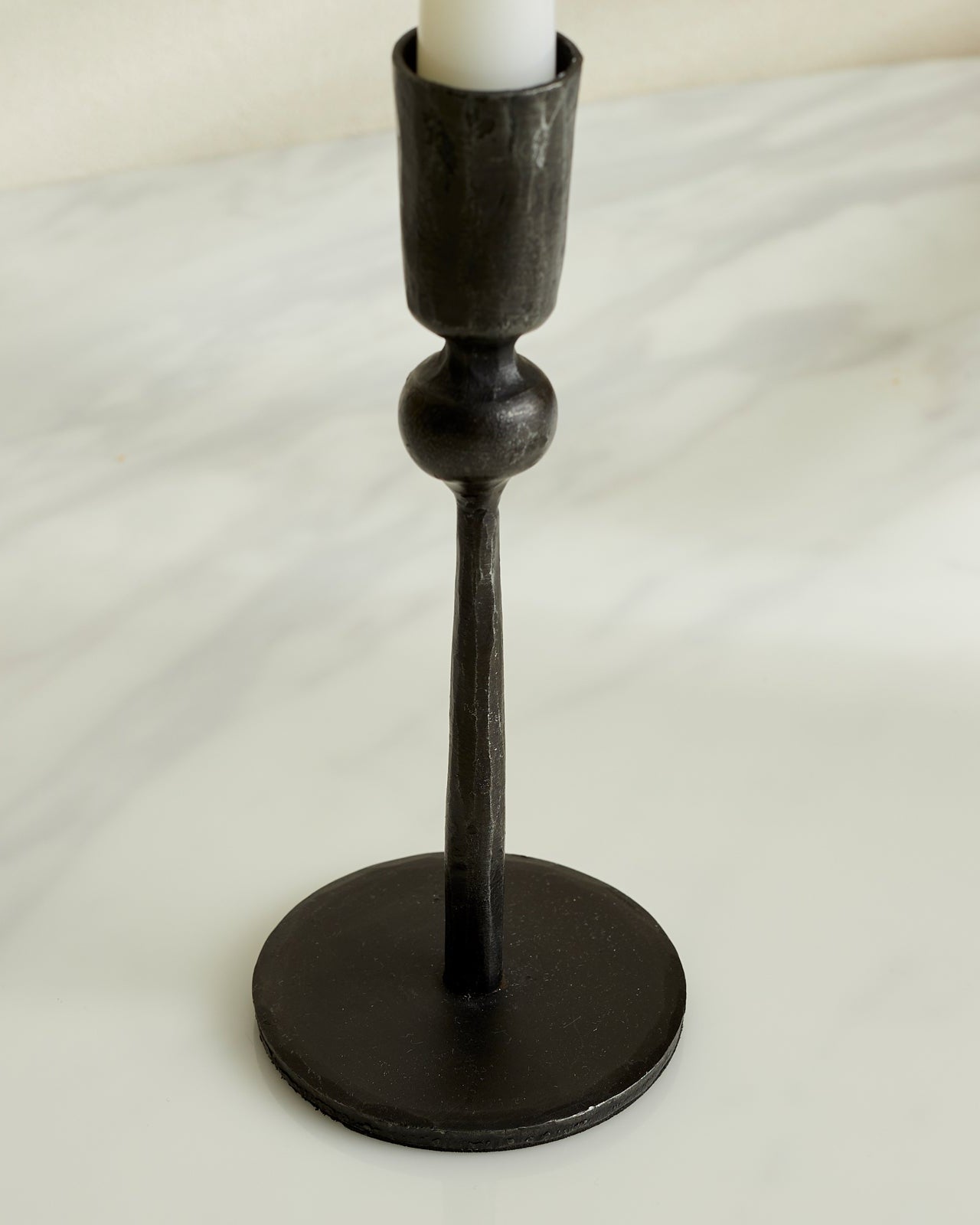 Close view of Coalbrook iron black candle holder showing matte texture and rounded shape