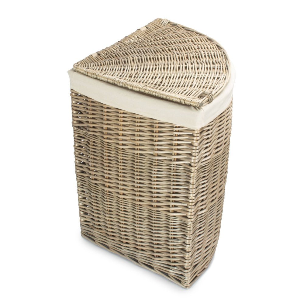 Corner wicker laundry basket antique wash with cotton lining displayed on blank background
