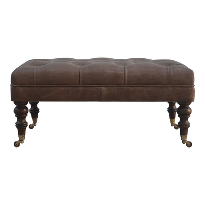 Buffalo hide ottoman with deep-buttoned top and castor-legged walnut mango wood base, part of The Godolphin Collection, suitable as a window seat or hallway bench, approx. 90cm wide × 60cm deep × 45cm high