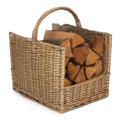 Handwoven antique wash wicker log basket filled with split firewood