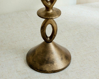 Close view of Ludlow gold candle holder base, irregular sculptural shape with modern elegance