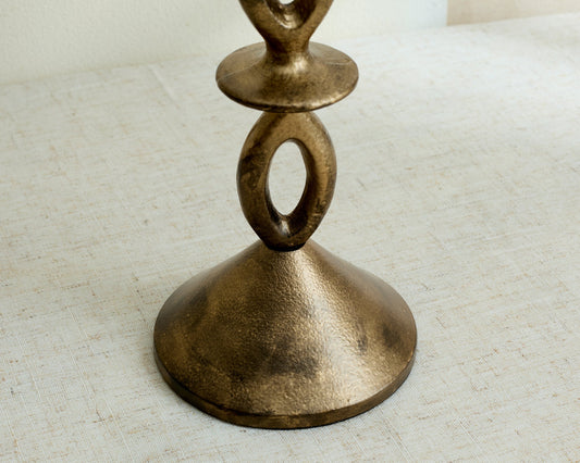 Close view of Ludlow gold candle holder base, irregular sculptural shape with modern elegance