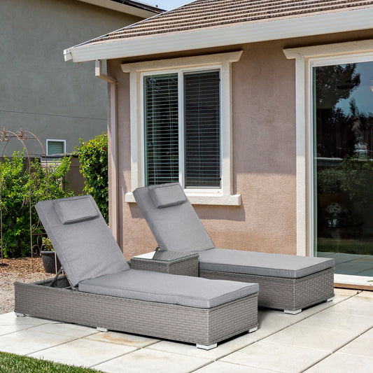 The Mottisfont Lounging Trio – 3-piece outdoor rattan sun lounger set in weathered grey, styled on a patio with reclining loungers and side table in a relaxed garden setting