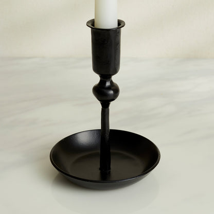 Close-up of Noa black iron candle holder with matte finish, forge-style decor for rustic mantle or winter table setting