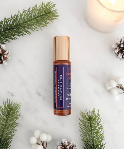 Side view of peppermint eucalyptus pine roll-on Christmas aromatherapy gift with festive sprigs
