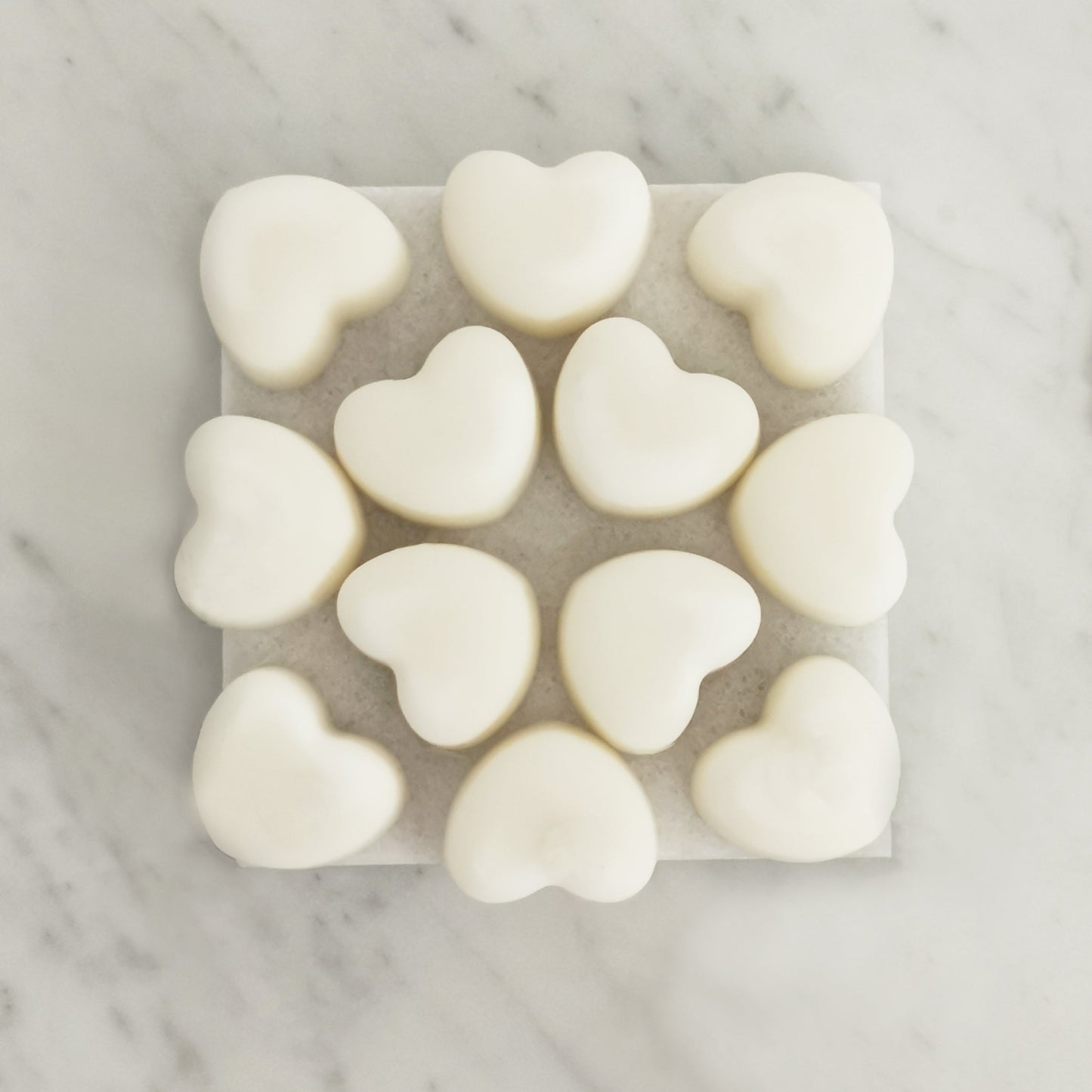 Peppermint eucalyptus pine wax melts with organic essential oils displayed on rustic tile surface

