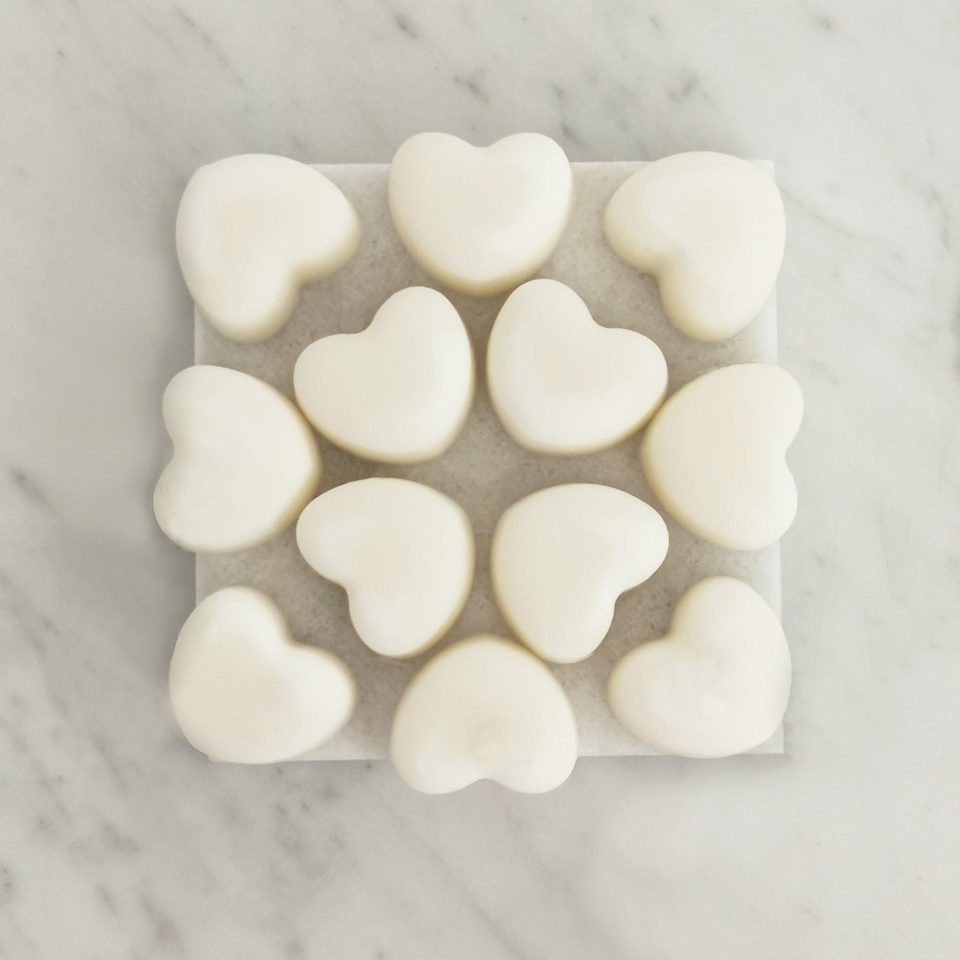 Peppermint eucalyptus pine wax melts with organic essential oils displayed on rustic tile surface
