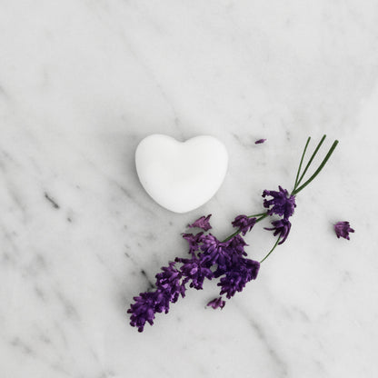 Single lavender ylang ylang wax melt displayed on table for festive aromatherapy gift
