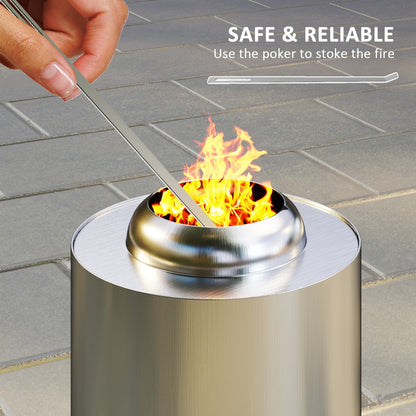 25cm smokeless fire pit in silver stainless steel with poker in use, compact garden heater for safe stoking and soulful outdoor gatherings
