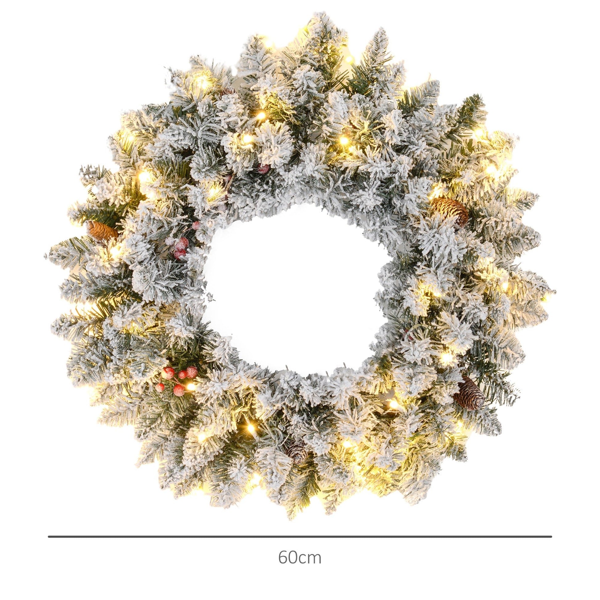 Close-up of snowy 60-inch Christmas wreath with pinecones, berries & warm LED lights — lifelike branches with visible depth and festive scale.