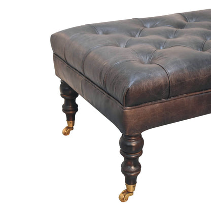 The Edgcumbe Ottoman – Ash Black Buffalo Hide & Castor - Leg Seat - The Timeless Trading Co.