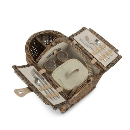 Boat-shaped wicker picnic basket with fitted interior — styled for meadow walks, harbour lunches, and timeless countryside gatherings