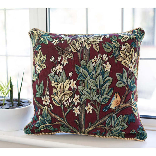 Tree of Life cushion in rich red tapestry, William Morris design, styled on windowsill with countryside calm and heritage charm