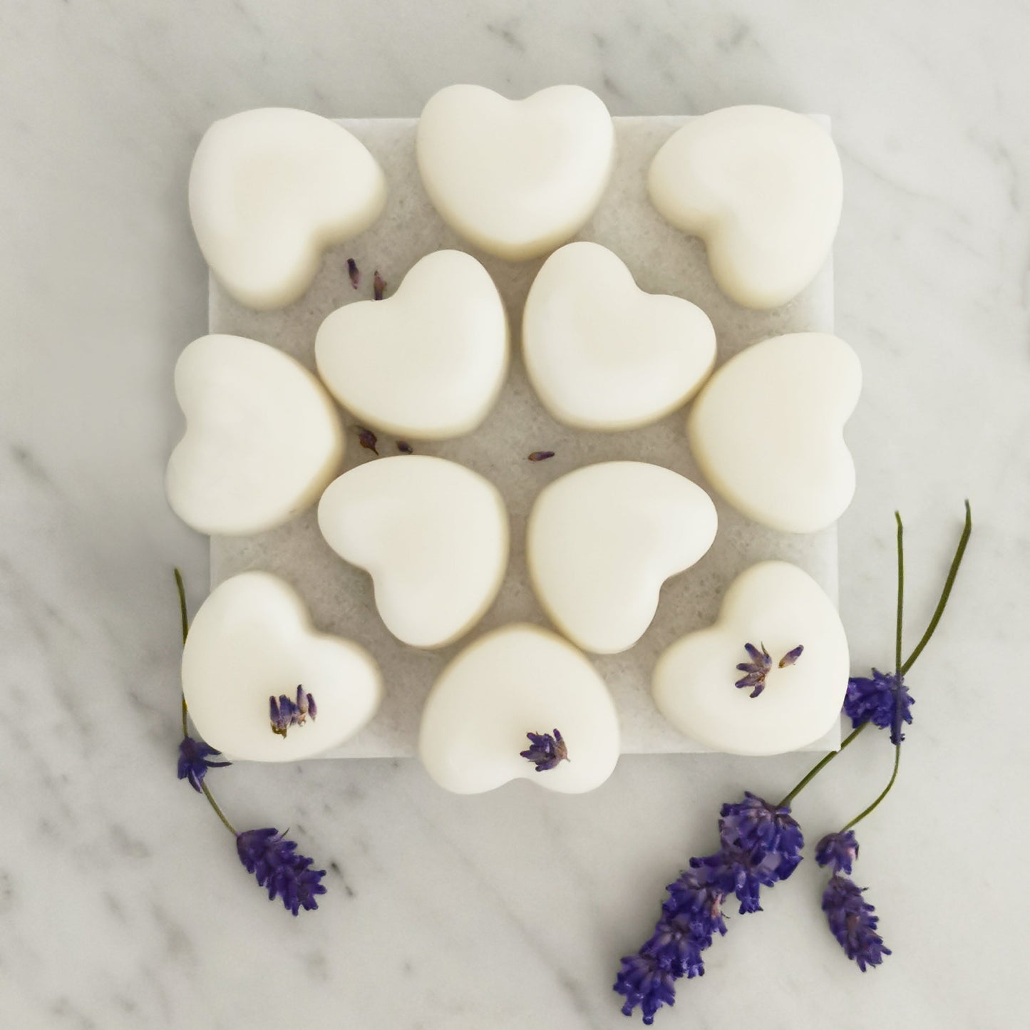Twelve lavender ylang ylang wax melts displayed on table for festive aromatherapy gift
