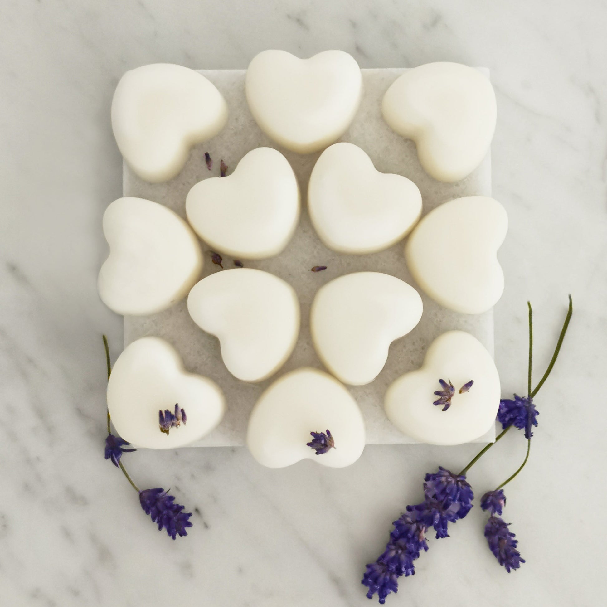 Twelve lavender ylang ylang wax melts displayed on table for festive aromatherapy gift
