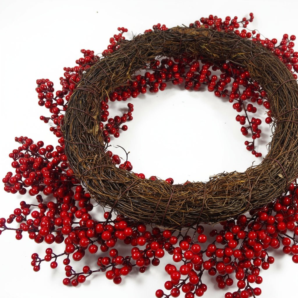 Underside of red berry Christmas wreath showing wire frame and branch detail