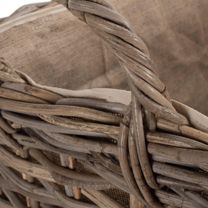 Close-up of The Wainsford Log Keeper’s curved rattan handle – antique wash weave crafted for fireside comfort and easy movement through heritage-inspired interiors