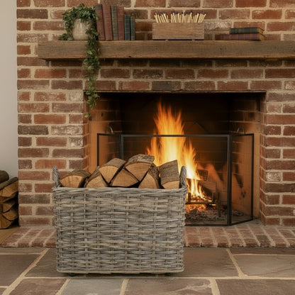 Side view of The Wainsford Log Keeper – antique wash rattan log basket with hessian lining and wheels, crafted for fireside storage and countryside comfort