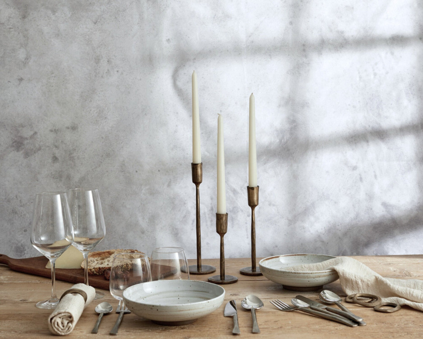 Weldon iron candle holder set rustic taper holders all three sizes styled on dinner table setting

