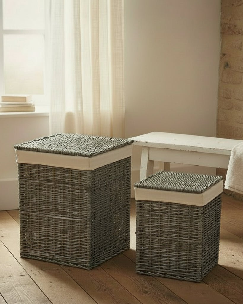 Set of two antique wash wicker laundry baskets with white cotton lining, square design in room interior
