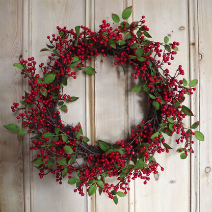 The Winthrop redberry wreath on rustic door, 24 inch round festive styling with heritage foliage and snow-kissed seasonal tones